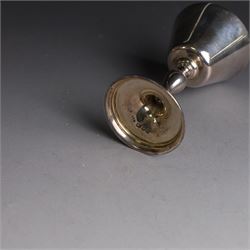 Mid 20th century silver travelling communion set, comprising goblet, paten and pyx, all hallmarked Hurst, Franklin & Co Ltd, London 1961 & 1962, with a glass bottle with unmarked cover, all within a tooled leather fitted case, goblet H9cm