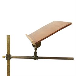 Victorian mahogany and brass adjustable music stand, tilting rest with edge, height adjustment mechanism to central column, supported on cast iron quadriform base