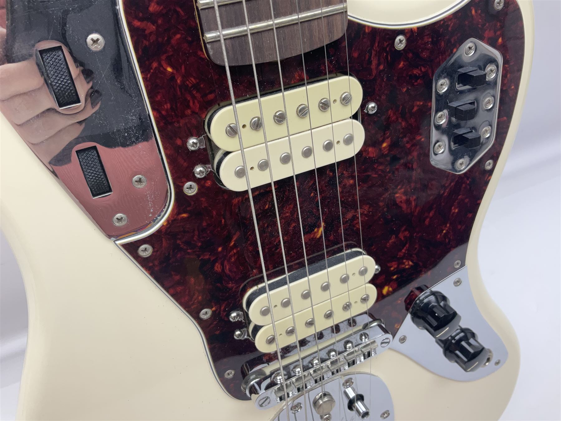 Mexican Fender Jaguar electric guitar with Humbucker pick-ups and tremolo arm, serial no.MX16741977, L101cm; in soft carrying case