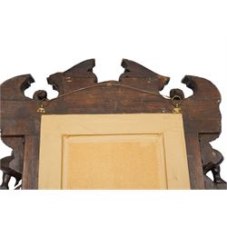 Renaissance-style mid 19th century carved fruitwood wall mirror, carved top surmounted by ‘broken’ arched pediment with central putti figure and grape vine, the sides with two putti figures above C-scroll decorations, and with a similarly carved base