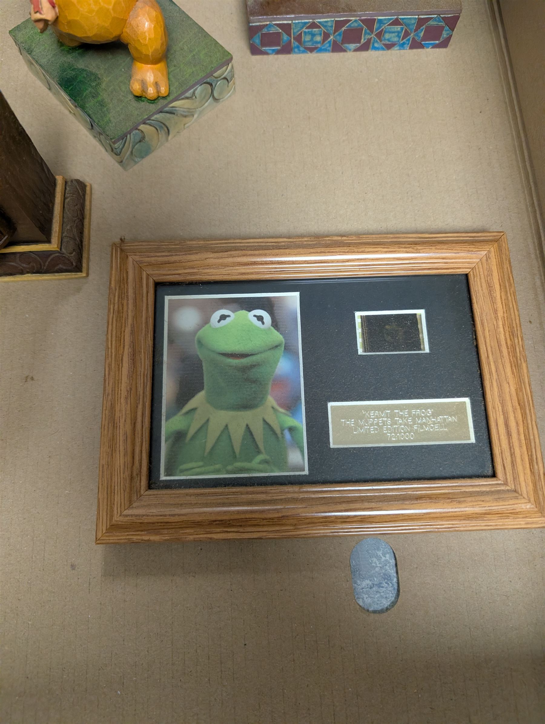 Collection of Disney and similar figures and memorabilia, including Pirates of the Caribbean Capt Jack Sparrow talking figure and NECA toys Jack Sparrow Head Knocker, three Disney showcase figures, Kermit the Frog framed film cell and Tomb Raider figure