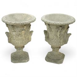 Late 20th century set of four composition stone campana urns, each with everted rim over acanthus and mask relief decoration, tapering to a fluted socle on square plinth base