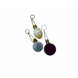 Cut glass perfume bottle of bellied form, the silver mounted cover with turquoise guilloche enamel top, hallmarked Henry Perkins & Sons, London 1927, together with a cut glass perfume bottle with silver mounted and yellow guilloche enamel lid, hallmarked Albert Carter, Birmingham 1950, Continental silver perfume bottle, of barrel form with embossed figural detail, stamped 930, scent bottle of bellied form with white metal foliate pierced overlay, amethyst glass scent bottle of flask form with foliate embossed white metal cover and suspension ring and chain, and three further examples, including one of ovoid form with painted decoration and silver cover, hallmarked for Birmingham.