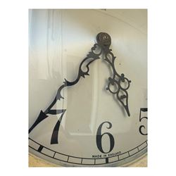 English- Art deco mahogany 8-day longcase clock, with an arched top and fill length fully glazed door beneath, on a short plinth with bracket feet, three train chain driven movement with visible stainless steel cased weights and pendulum, silvered dial with Arabic numerals, minute track and pierced steel hands, quarter chiming movement with  Westminster/ Whittington/ strike/silent selection.
