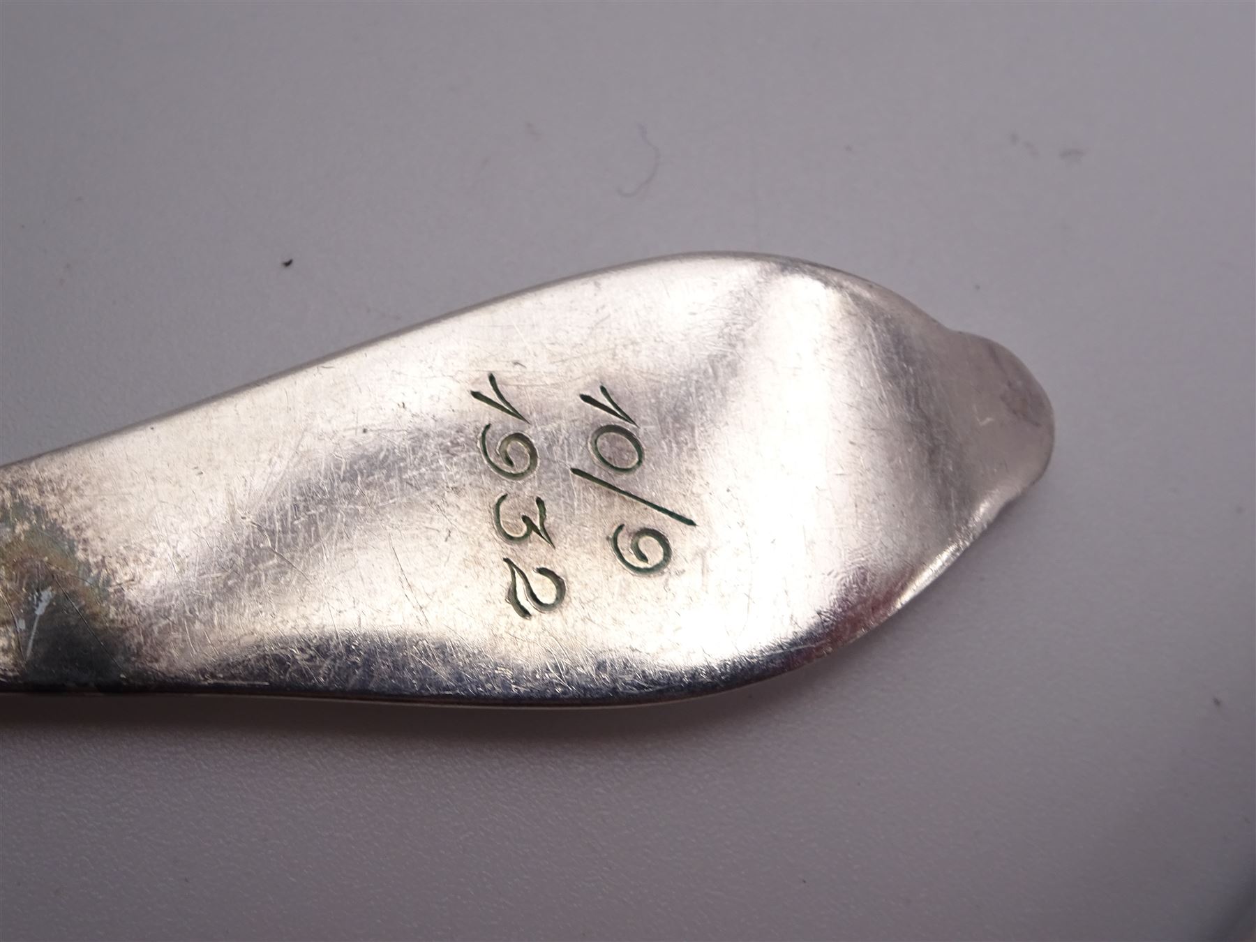 1930s Norwegian silver cutlery for six place settings, comprising table spoons, table forks and silver handled table knives, cake forks, tea spoons and demitasse spoons, one cake slice, serving spoon, sauce ladle and a pair of silver handled servers, all embossed with rose decoration and engraved with initial K to terminal and 10/9 1932 verso, stamped NM 830s