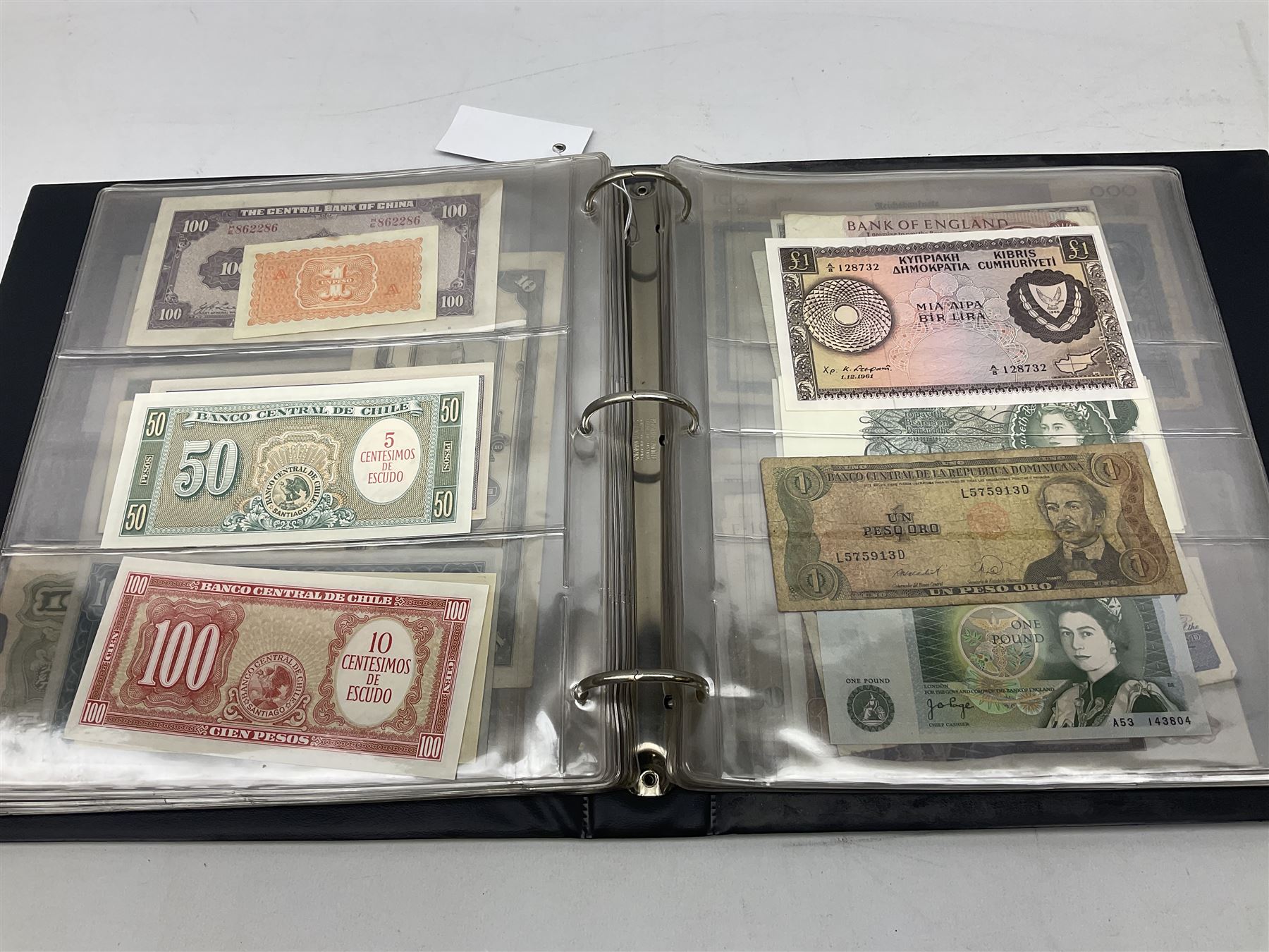 World banknotes, including Queen Elizabeth II The States of Jersey one pound 'DB202703', five pounds 'BB527762' and ten pounds 'AB651481', reserve bank of New Zealand two dollars '1L3 741894', King George V Straits Settlements one dollar 1st January 1935 'F/83 28924', various Bank of England notes etc, housed in two ring binder albums
