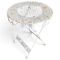Three-piece French style white-painted wrought iron garden bistro set, comprising a circular folding table with latticework top and apron with scrolling foliate motifs (W70cm H80cm) and matching pair of chairs, with scrolling cresting rail and acorn finials over a scrolled foliate medallion, raised on lattice seat and folding X-frame base (W42cm H93cm)