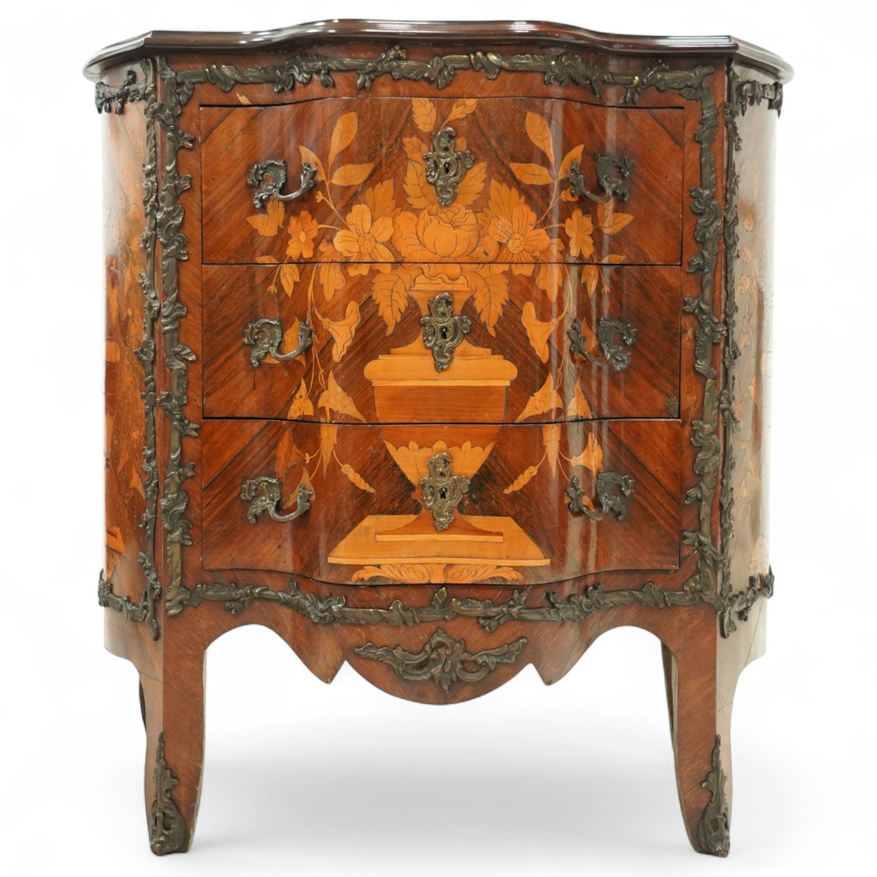 French Louis XV design serpentine fronted rosewood and fruitwood commode, the later shaped mahogany top over  three drawers, inlaid with a floral marquetry urn and flowers, within ormolu mounted borders, the sides inlaid with matching bouquet marquetry, raised on bracket feet