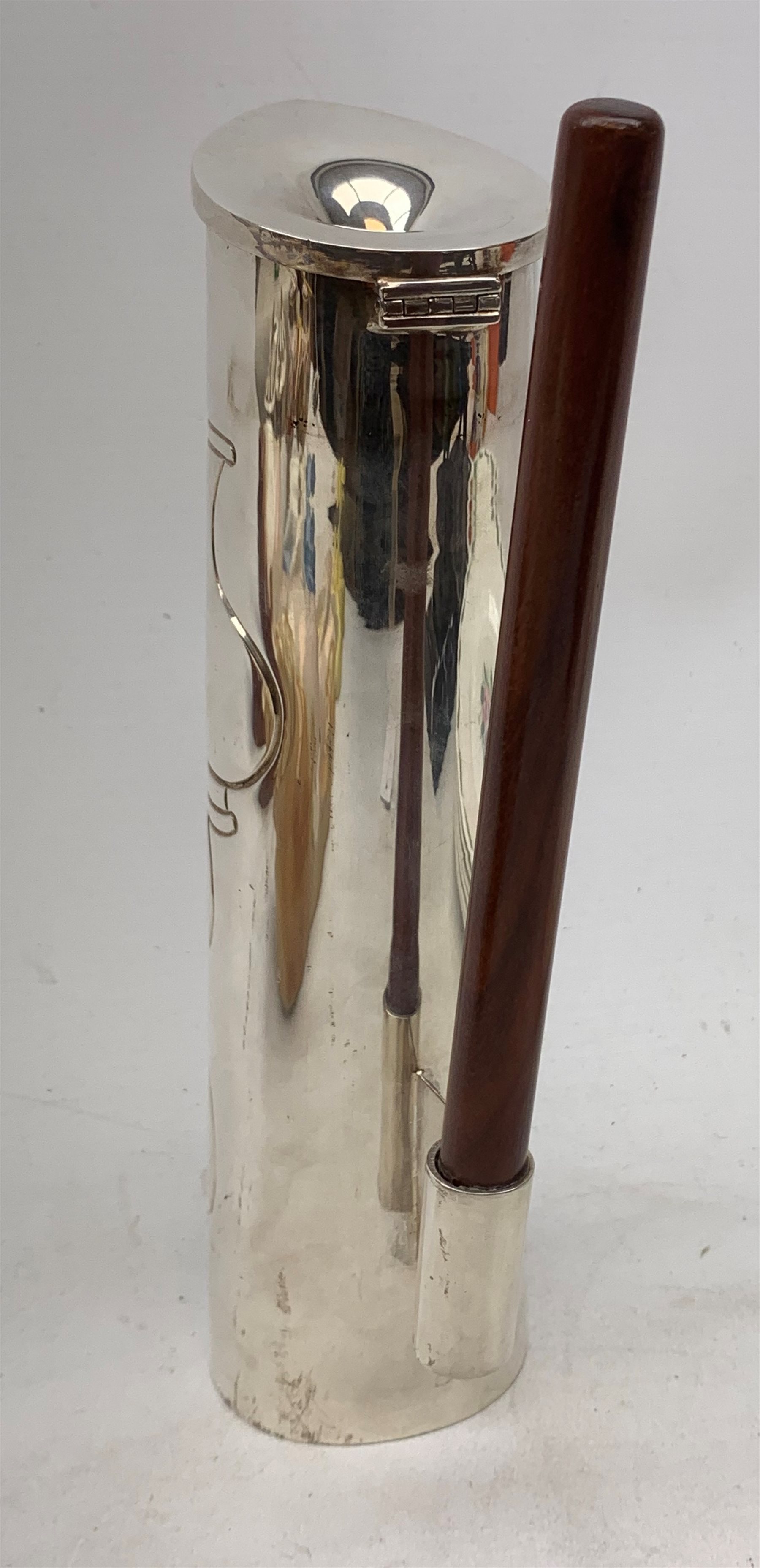 A silver plated Ravissant water jug, of cylindrical form with wooden open handle, detailed with a group of vases, marked beneath Ravissant, H25.5cm.  