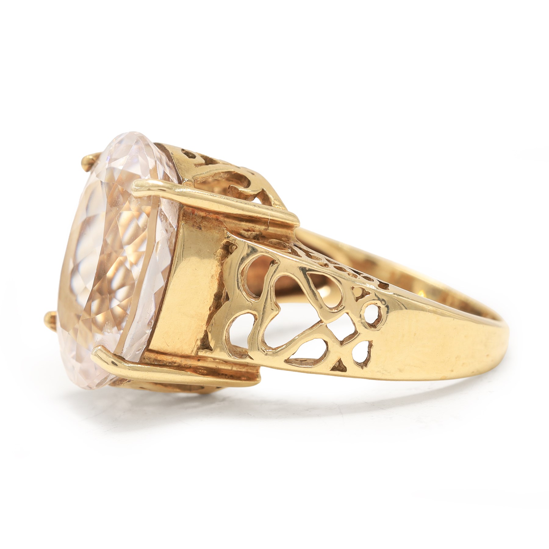 9ct gold kunzite ring, four claw set with a single oval cut kunzite, pierced design gallery and shoulders