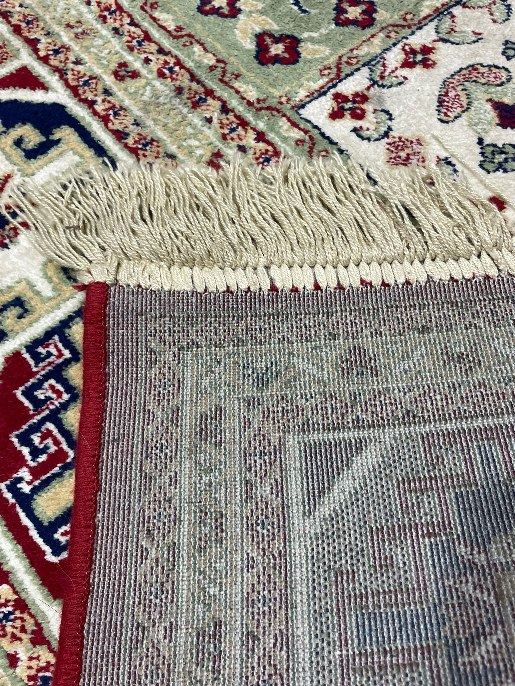 Bakhtiari design rug, the field divided into panels each decorated with tree of life and floral motifs, the main border decorated with Hac motifs 