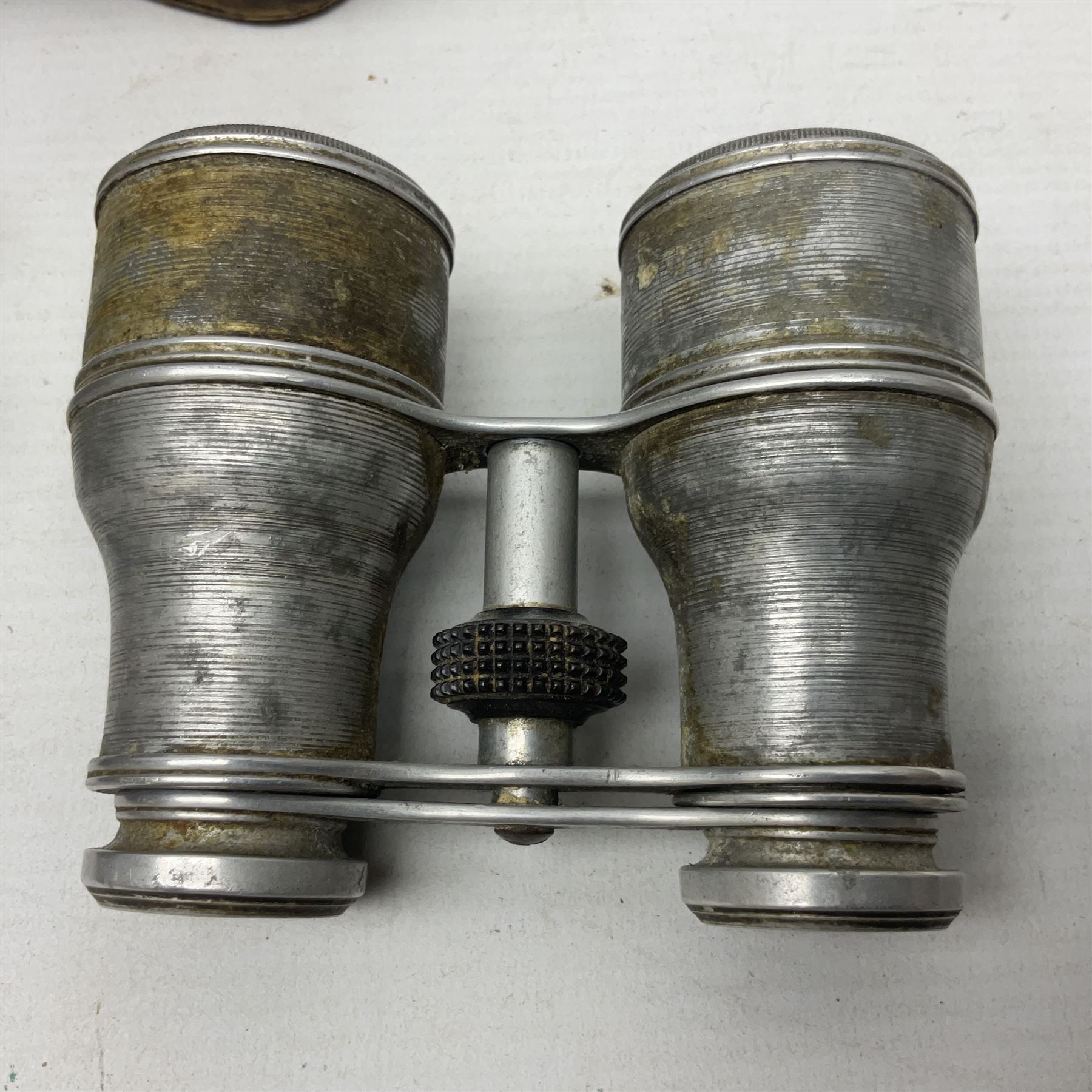 Mundial Brazil bowie knife, the 15.5cm steel blade inscribed 'Sheriff Knife', with banded and aluminium hilt; in leather sheath L29cm overall; British Army felt covered metal water bottle with webbing strap; leather 12-bore cartridge belt; and small pair of non-military binoculars in part case (4)