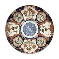  Large early 20th century Japanese Imari wall charger, the centre painted with stylised blue roundel, surrounded by alternating shaped panels of flowers and phoenix, and foo dogs, D46cm