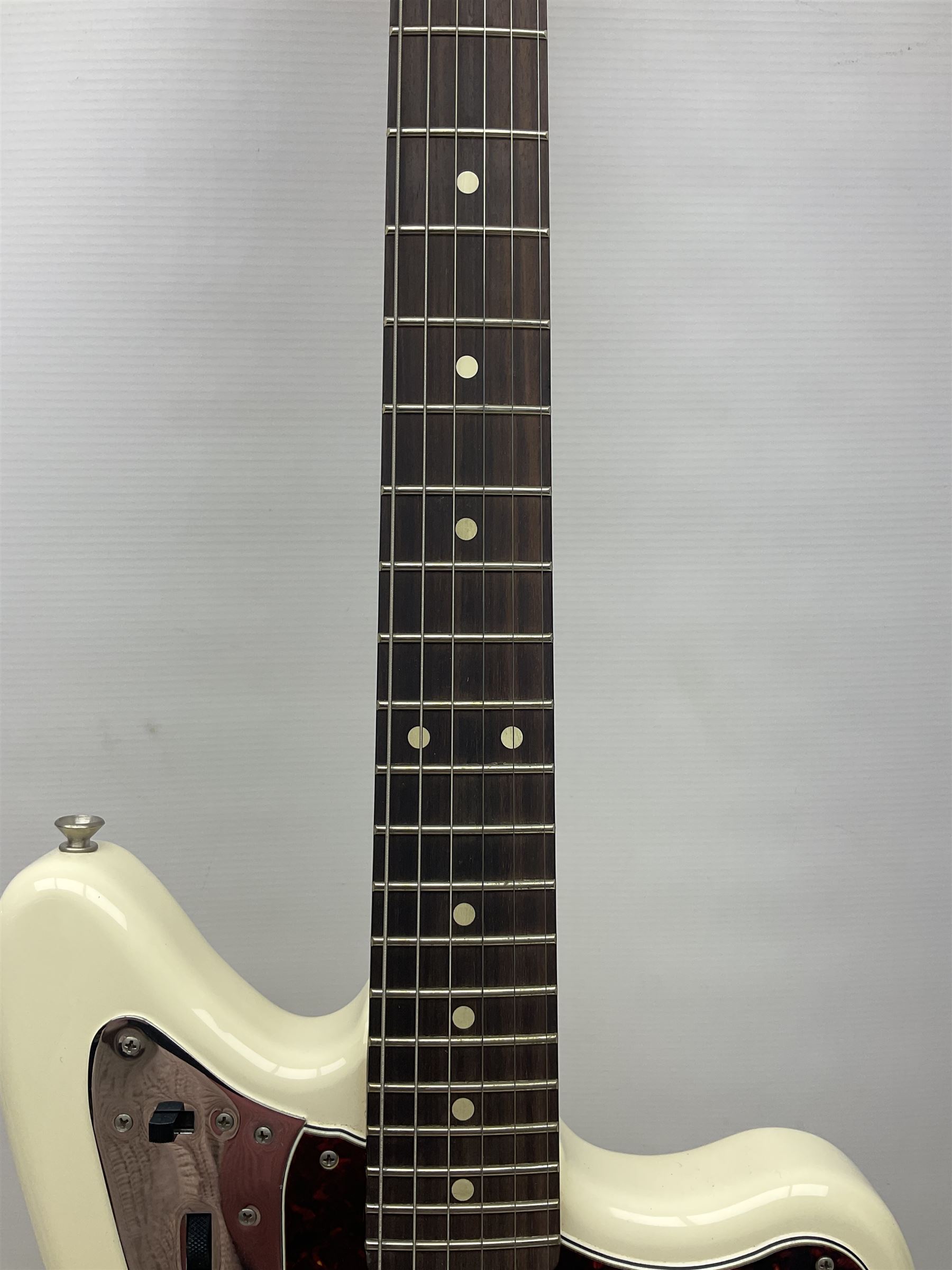 Mexican Fender Jaguar electric guitar with Humbucker pick-ups and tremolo arm, serial no.MX16741977, L101cm; in soft carrying case