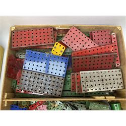 Meccano - quantity of loose playworn sections and pieces, Outfit instruction manuals , housed in yellow painted wood case, along with quantity of playworn die-cast model cars and vehicles etc