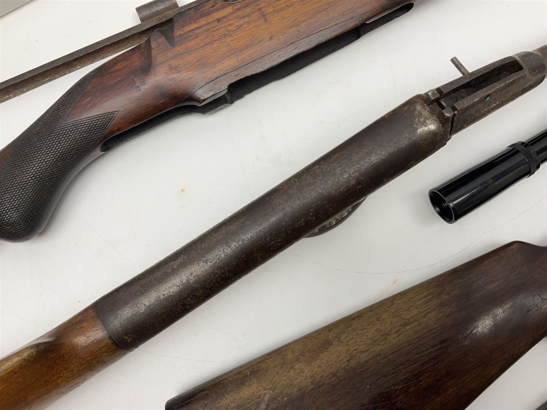 Assorted rifle and pistol spares; early Gem air rifle with sawn off barrel (piece present); telescopic sight; canvas/leather ammunition pouch; Mauser stock; barrel browning solution etc