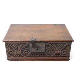 18th century oak desk box with plain hinged lid, the sides and front carved with stylised ...