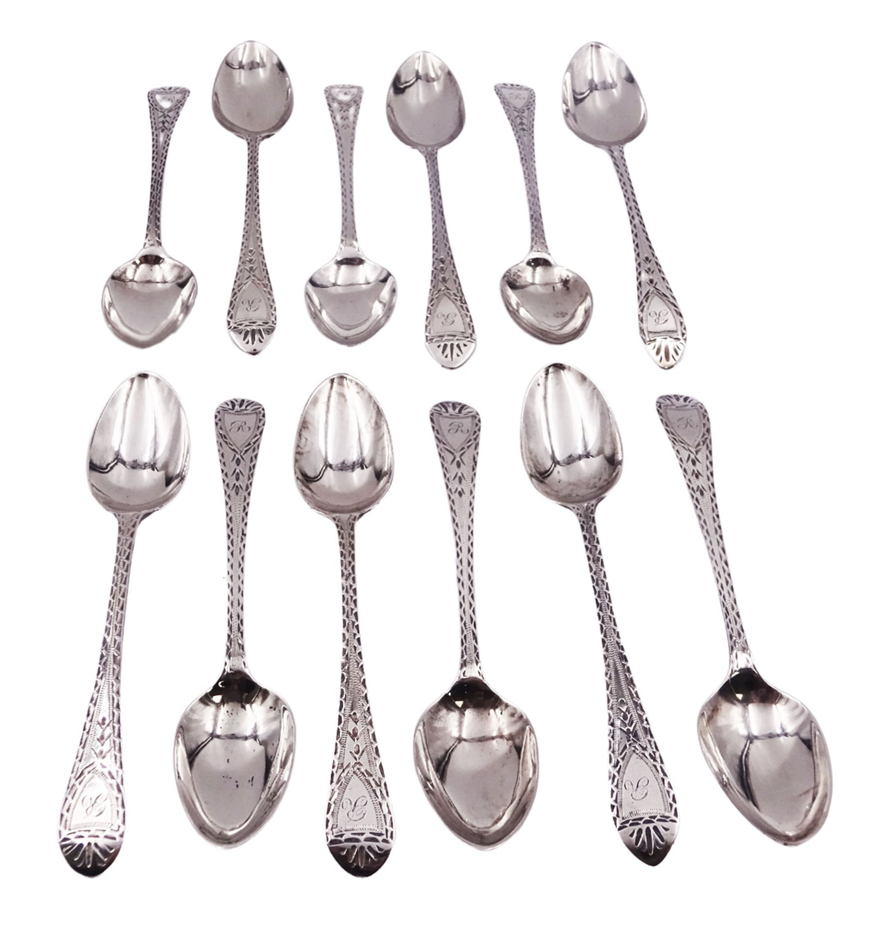 Set of twelve George III and later matched Celtic point pattern teaspoons, with bright cut engraved decoration, various hallmarks, to include a pair of William IV examples hallmarked James Beebe, London 1832, a further pair of William IV examples hallmarked William Chawner II, London 1830, approximate total weight 5.40 ozt (168.1 grams)