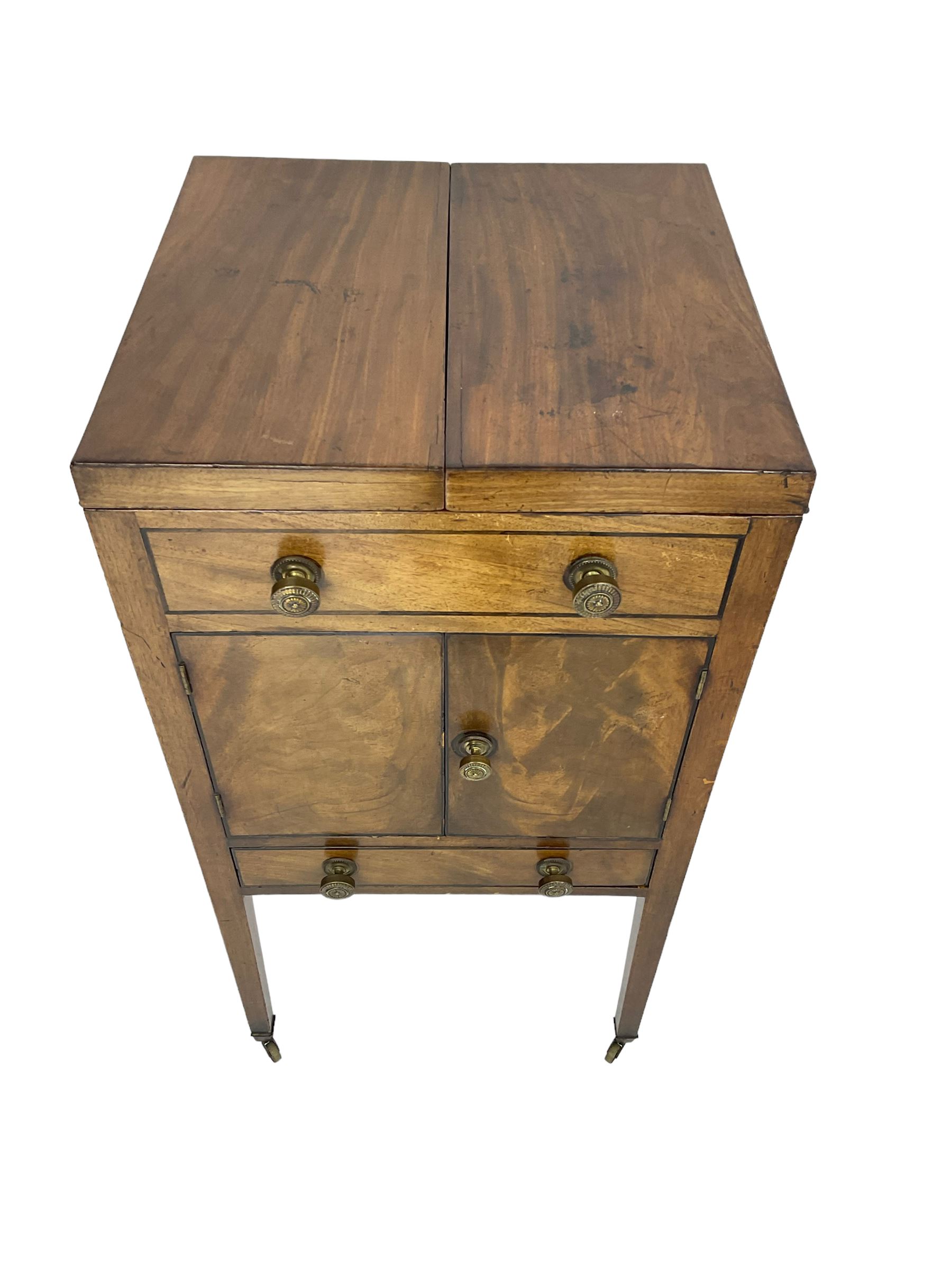 Georgian mahogany washstand cabinet, the double hinged lid opens to reveal wash basin and lift up tilting mirror, false drawer over double cupboard and drawer, on square supports with brass cups and castors