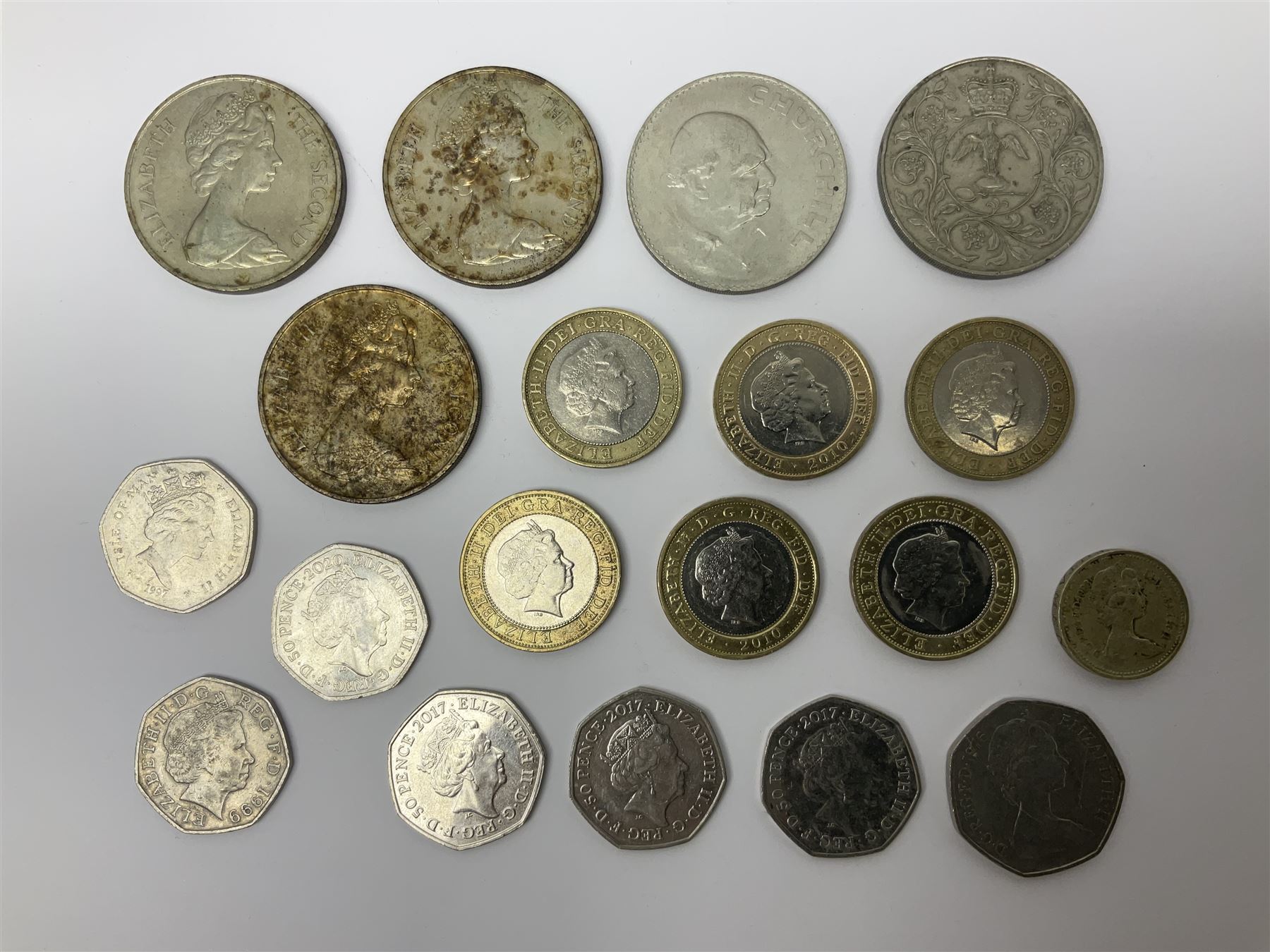 Queen Elizabeth II commemorative coins, including three Isle of Man 1970 crown coins, two further UK 1965 and 1970 crowns, three 2017 ‘Benjamin Bunny’ fifty pence pieces, two 1999 ‘Rugby World Cup’ two pound coins, Isle of Man 1999 ‘Phillip McCallen’ fifty pence piece etc