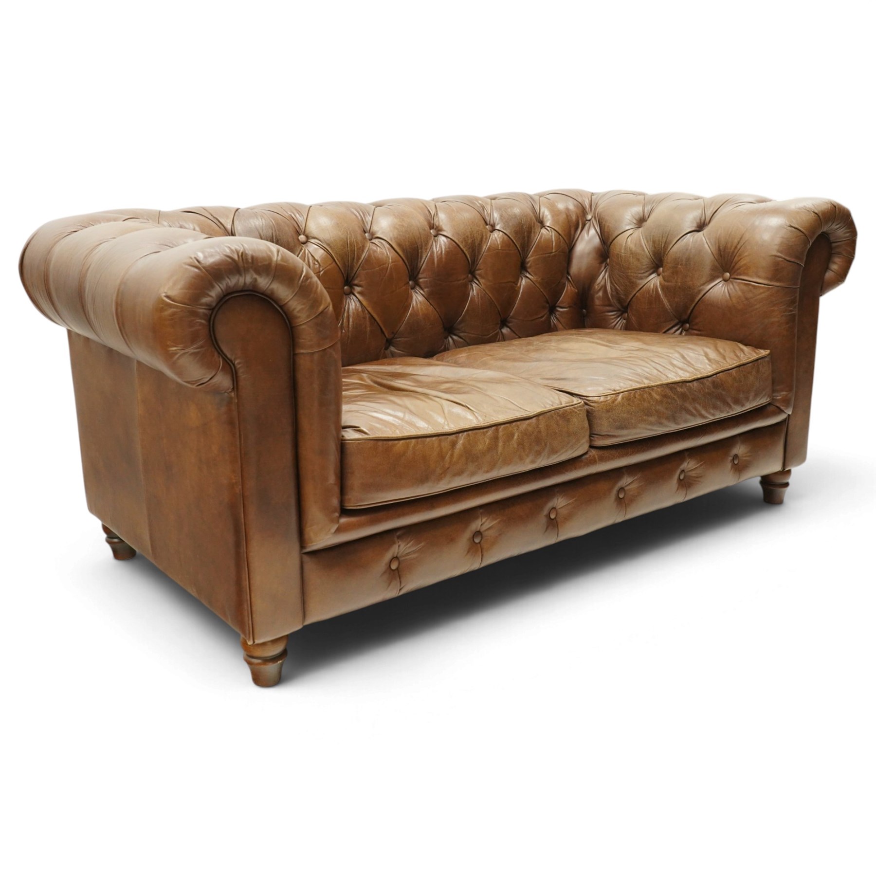 Timothy Oulton for Halo - two seater brown leather chesterfield settee, of traditional shape with rolled back and arms, upholstered in back-buttoned tan leather with loose seat cushions, raised on turned feet