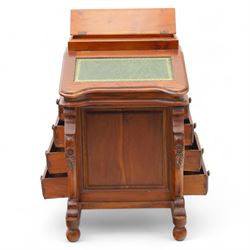 Victorian design mahogany Davenport desk, the sloped writing surface inset with tooled green leather and hinged to reveal a fitted interior, with a pen compartment to the raised gallery back, four drawers to each side, on carved scrolled supports with acanthus detail, raised on turned feet