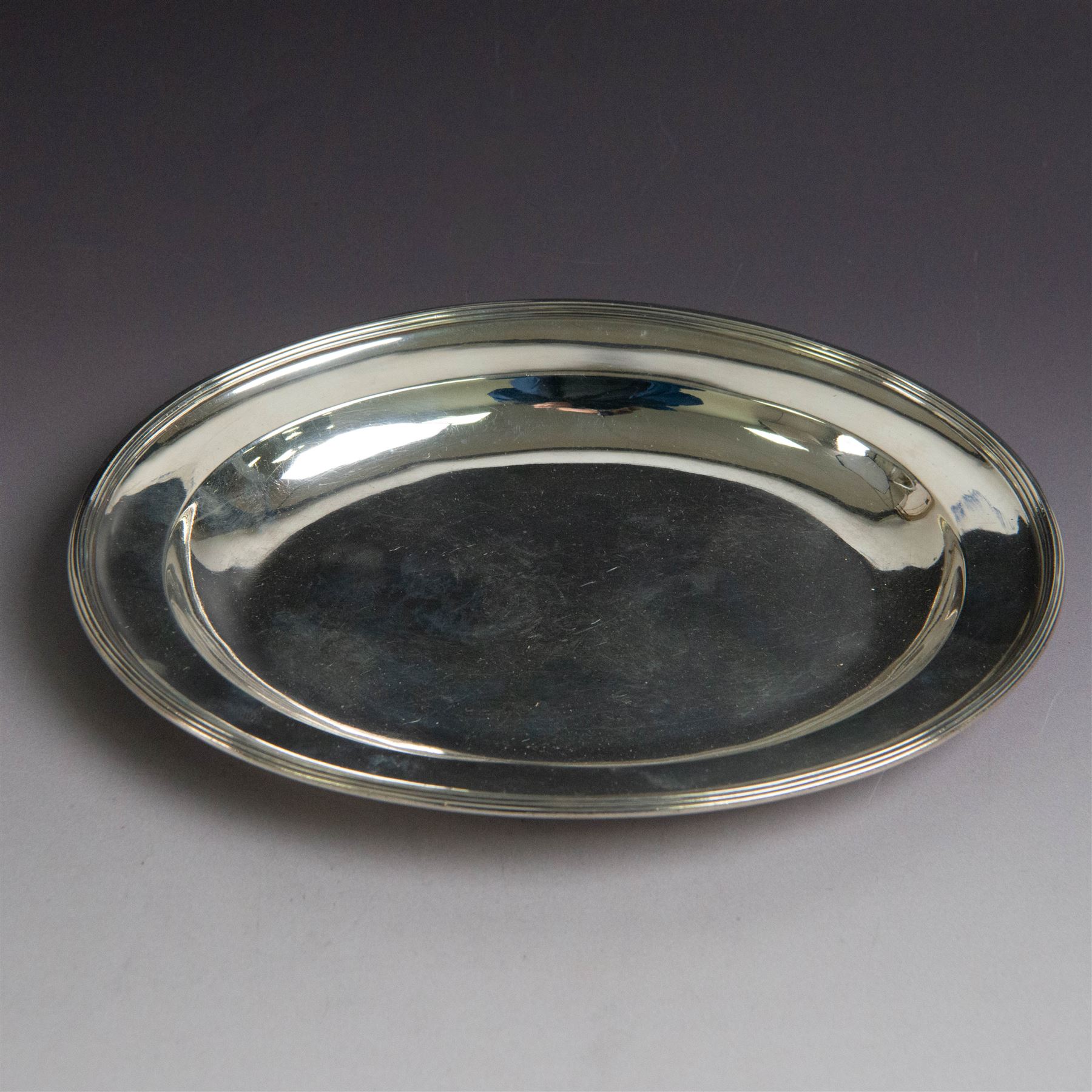 George III silver paten, of oval form, hallmarked Peter, Ann & William Bateman, London 1803, W21.5cm