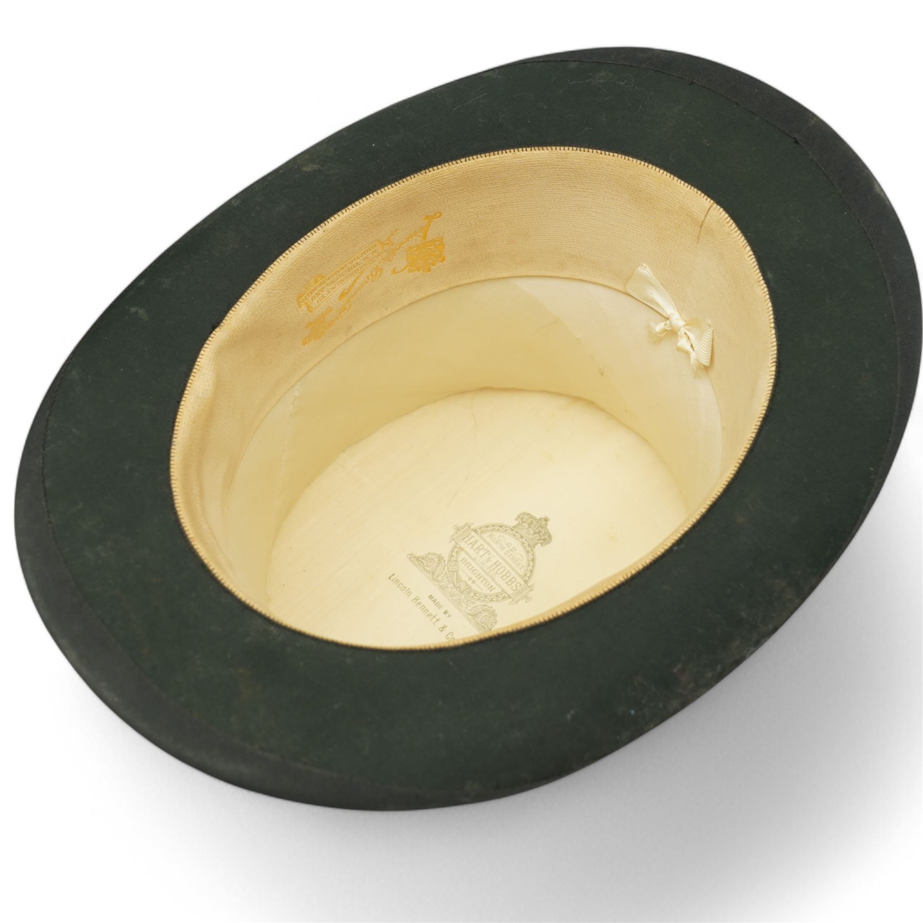 Black top hat by Lincoln Bennett & Co, retailed by Hart & Hobbs, in a Cuthbertson hat box, internal circumference approx. 54cm, and one other black top hat, internal circumference approx. 57cm (2)