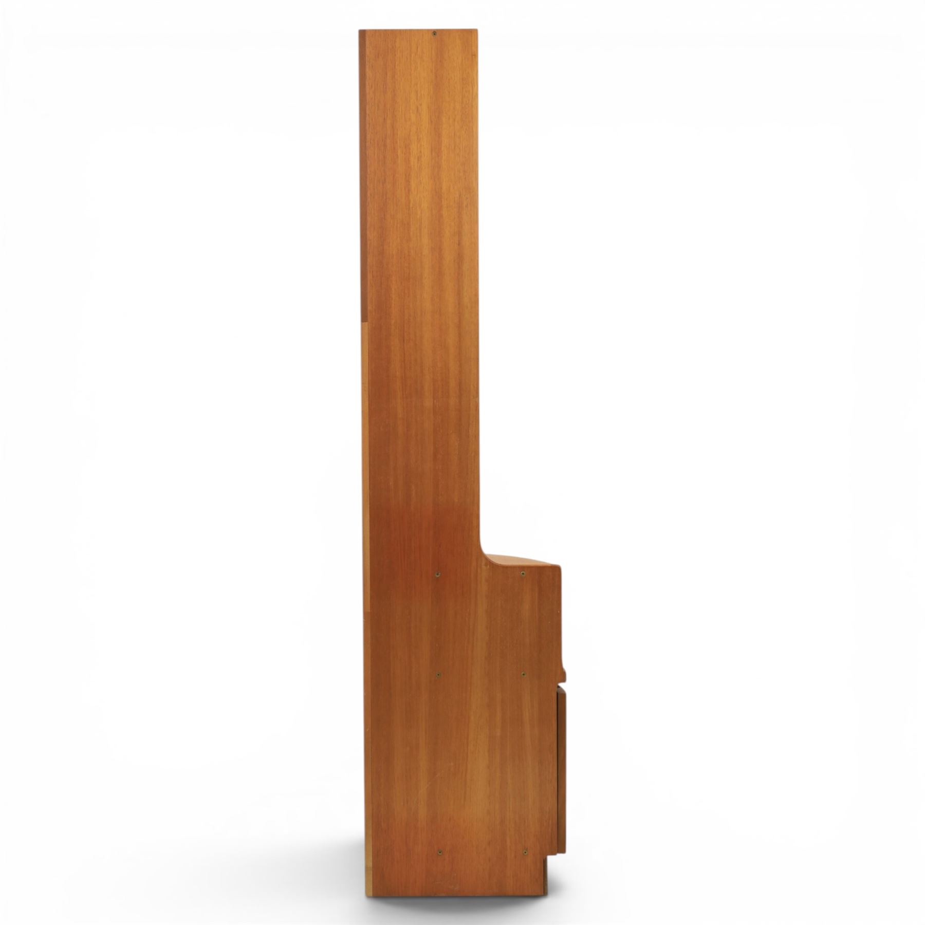 Nathan - teak corner cabinet, the upper section with moulded cornice and two fixed shaped open shelves, above a curved corner cupboard with twin signature square panelled doors, on a shaped plinth