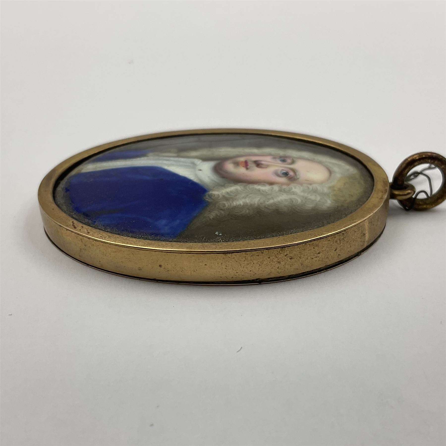 In the manner of Christian Zincke (German 1683-1767)
Portrait miniature upon enamel, circa 1750
Head and shoulder portrait of a gentleman in blue coat, possibly George II 
Within 9ct gold frame with ivory panel verso
Oval 4.5cm x 3.5cm

This item has been registered for sale under Section 10 of the APHA Ivory Act