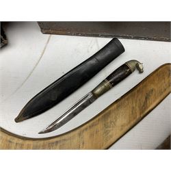 Assorted militaria including ten leather or canvas cartridge and other belts, maroon beret with 17th Lancers cap badge, modern bullet mould, leather and brass shot flask, two knives, shell cases, boomerang etc; in tin deed box