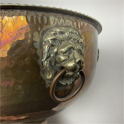 Copper pedestal punch bowl, with planished decoration with twin lion mask and ring handles and applied coins, H18cm