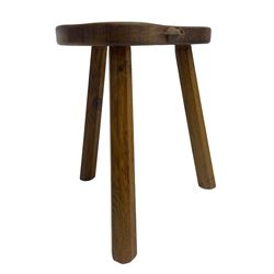 'Mouseman' oak three-legged stool, kidney shaped dished seat carved with mouse signature to edge, by Robert Thomas of Kilburn
