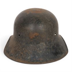 WWII German Third Reich M1940 helmet, with desert camouflage, the left inner brim stamped SE64, the back inner brim stamped 506, with leather eight tongue liner, together with German M34 helmet