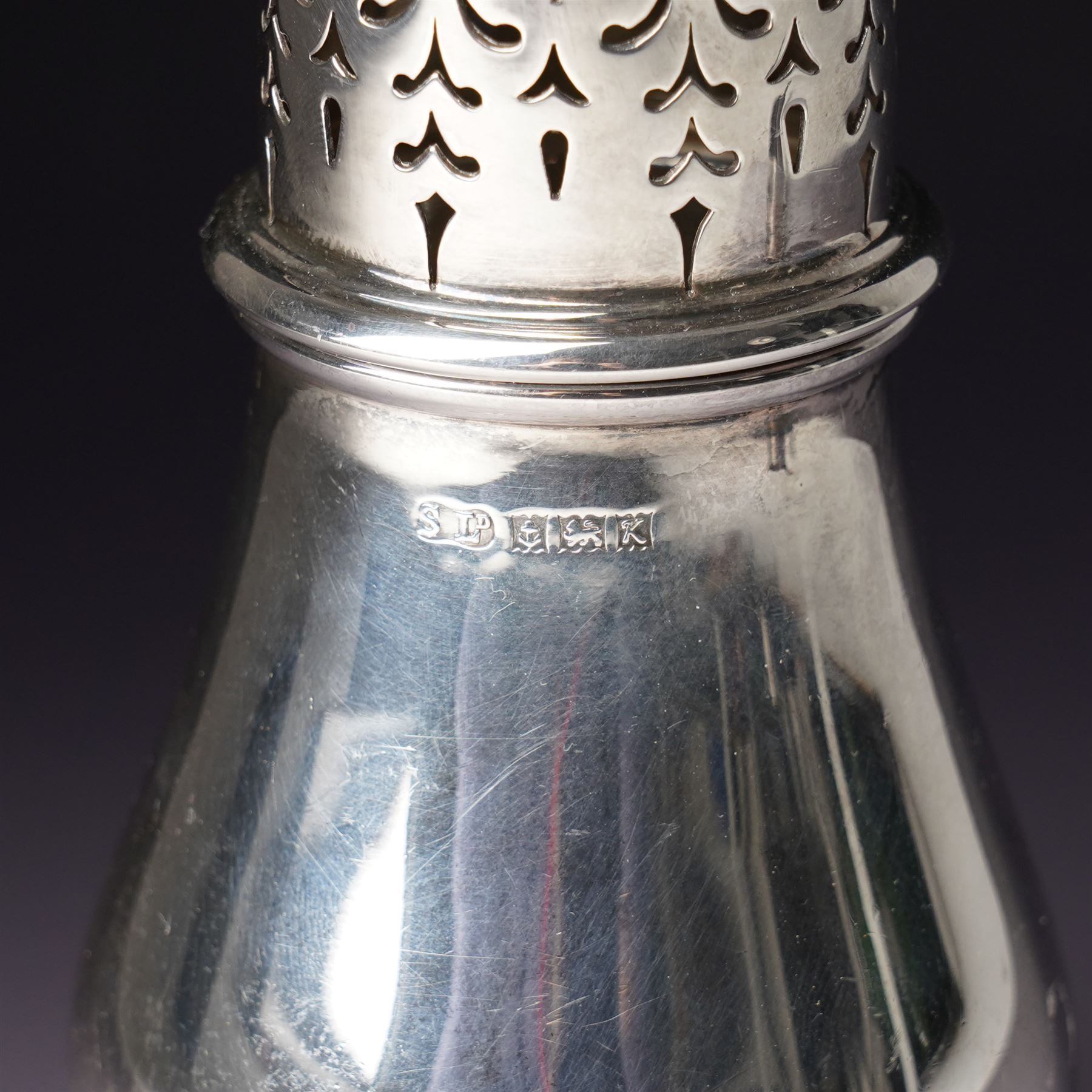 Georg Jensen sterling silver spirit measure of Art Deco design with flattened handle and a silver sugar caster Birmingham 1959