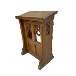 19th century oak ecclesiastical reading stand, panelled support with pierced arch design and chamfered uprights, on sledge feet