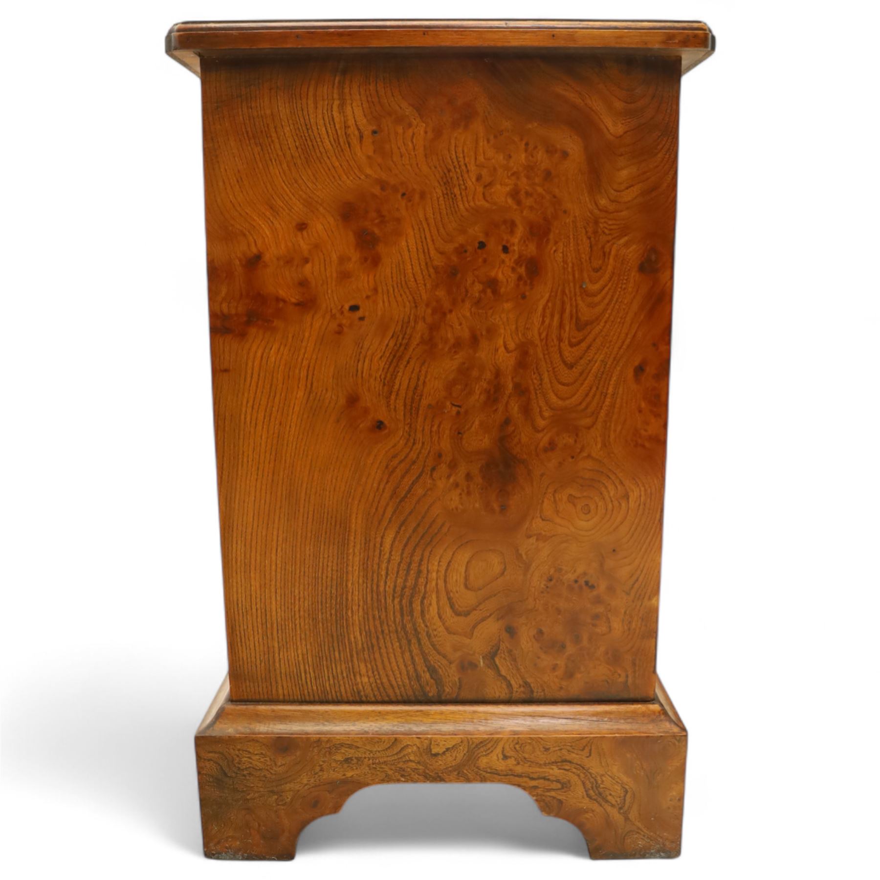 Late 20th century figured walnut miniature chest, the rectangular top with feather banded border over two short and two long drawers, fitted with brass batwing handles, upon moulded plinth base and four bracket feet, H60cm, w67cm, D36cm