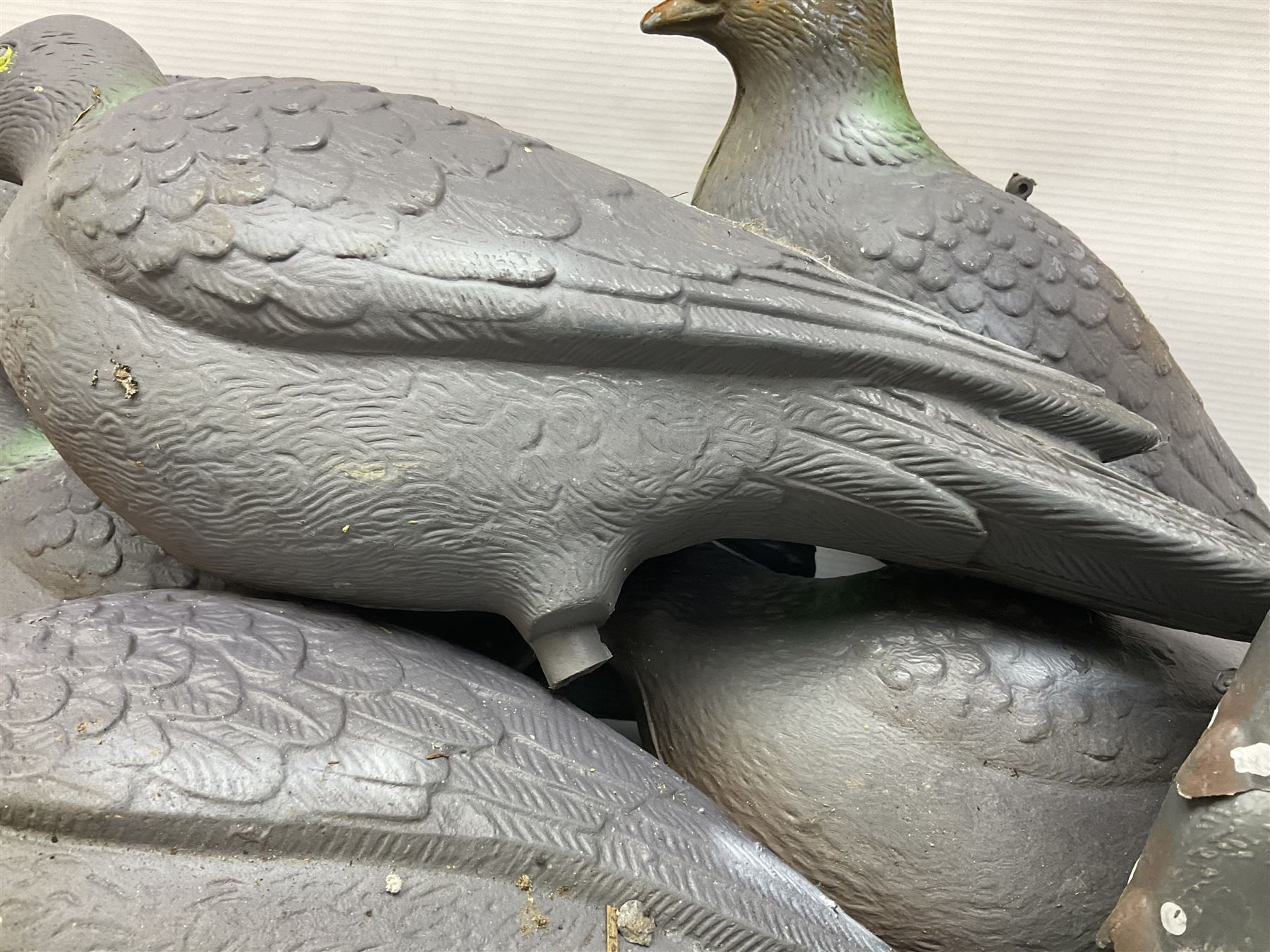 Eighteen plastic pigeon decoys comprising ten full body and eight shells with quantity of various stakes; some marked made in Italy