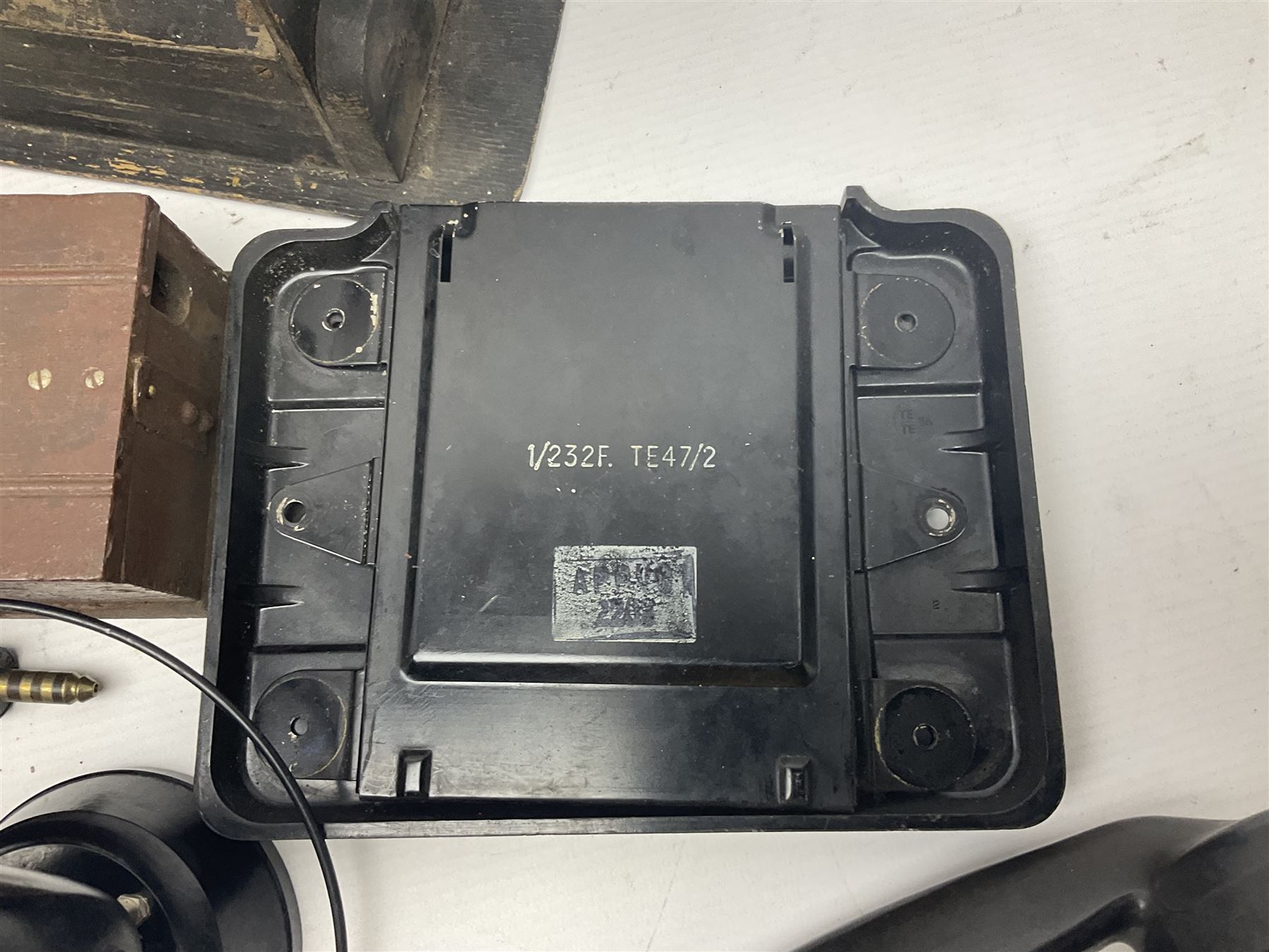 Collection of phone headsets, including GPO bakelite examples, together with other telephone parts 