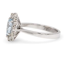 18ct white gold aquamarine and diamond cluster ring, single oval cut aquamarine of approx 0.85 carat, surrounded by twelve round brilliant cut diamonds, hallmarked, total diamond weight approx 0.50 carat