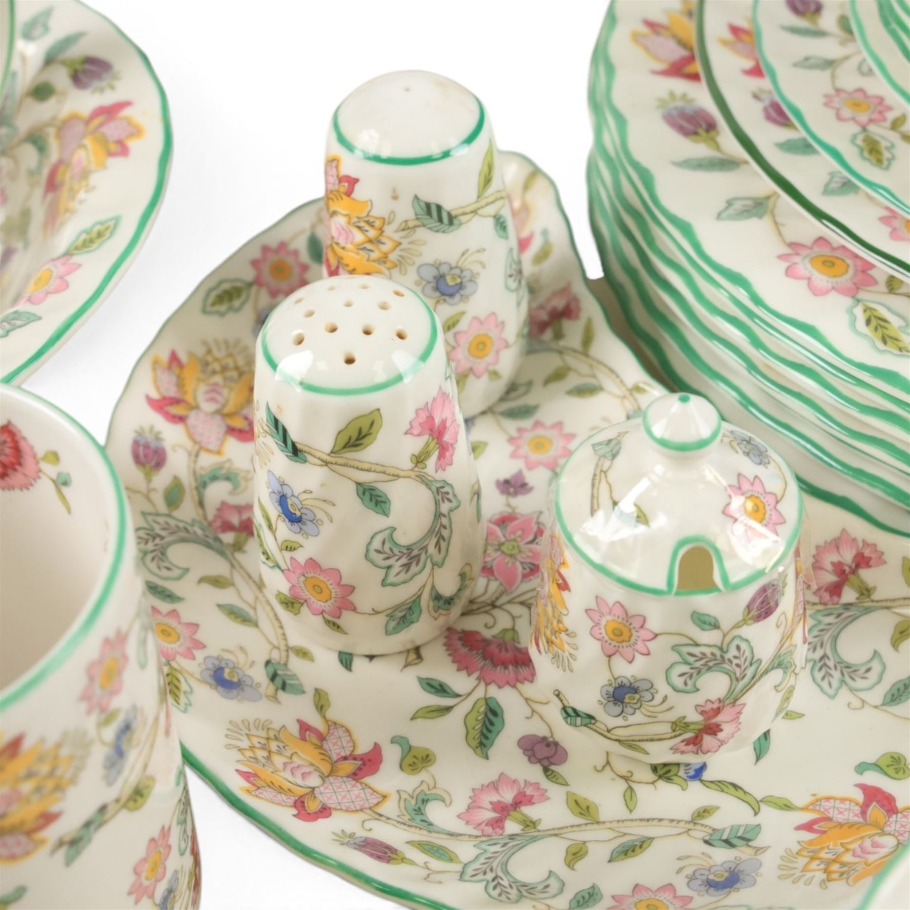 Minton Haddon Hall tea and dinner service, including teapot, milk jug, hot water jug, open sucrier, ten teacups and eight saucers, eight dinner plates, eight soup bowls, etc 