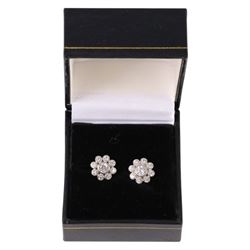 Pair of silver flower design stud earrings, boxed 