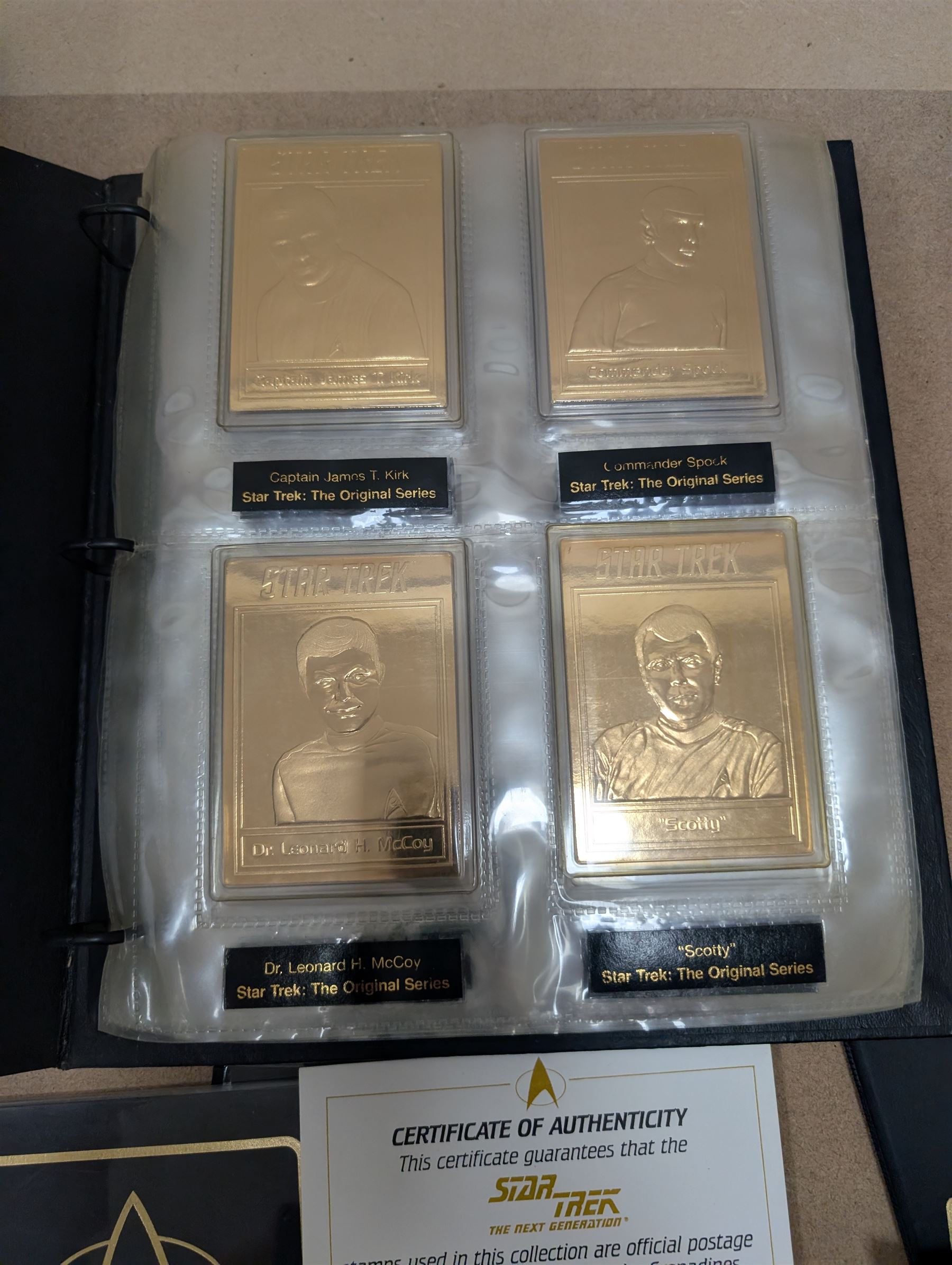 Star Trek collectables, including Danbury Mint '22ct Gold Card Collection', PCS Stamps and Coins Official US Postage Celebrating The Original Star Trek Series, Star Trek St Vincent and Grenadines first day cover collection, four stamp sets and a framed set of similar stamps, commemorative coins, Star Trek The Experience Las Vegas coin, three commemorative 'gold stamps' and three albums of collectors cards and telephone cards