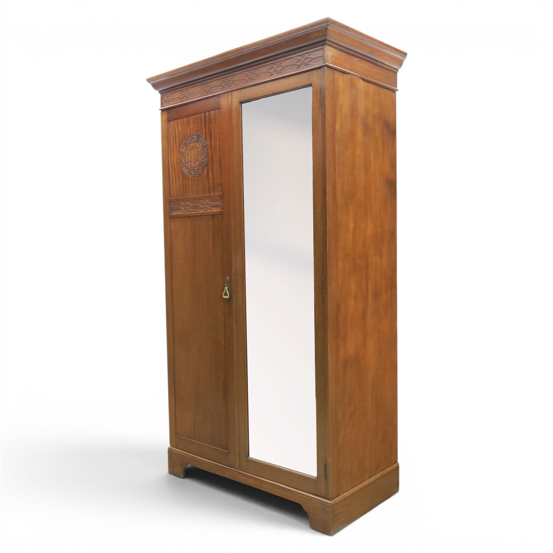 Quality Edwardian mahogany double wardrobe, featuring bevelled mirrored and panelled door with applied moulded detail, internal brass rail hanging and shoe rails