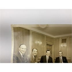 Early 1970s sepia photograph of the Pools Panel meeting at The Waldorf Hotel, London including Raich Carter, Marquis of Bath, Arthur Ellis, Neil Franklin etc 19 x 25cm; together with a beech spaghetti server with manuscript presentation inscription 'To Raich Carter from Henry 6th Marquis of Bath 1974'; Provenance: By direct descent from the family of Raich Carter having been consigned by his daughter Jane Carter (2)