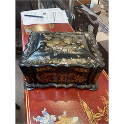 Victorian black lacquered papier-mâché sewing box, of rectangular form with shaped sides, the slightly domed top with inlaid mother of pearl and abalone decoration, the sides with gilt and polychrome painted scrollwork, the hinged cover opening to reveal a fitted interior with lift out tray, H14cm