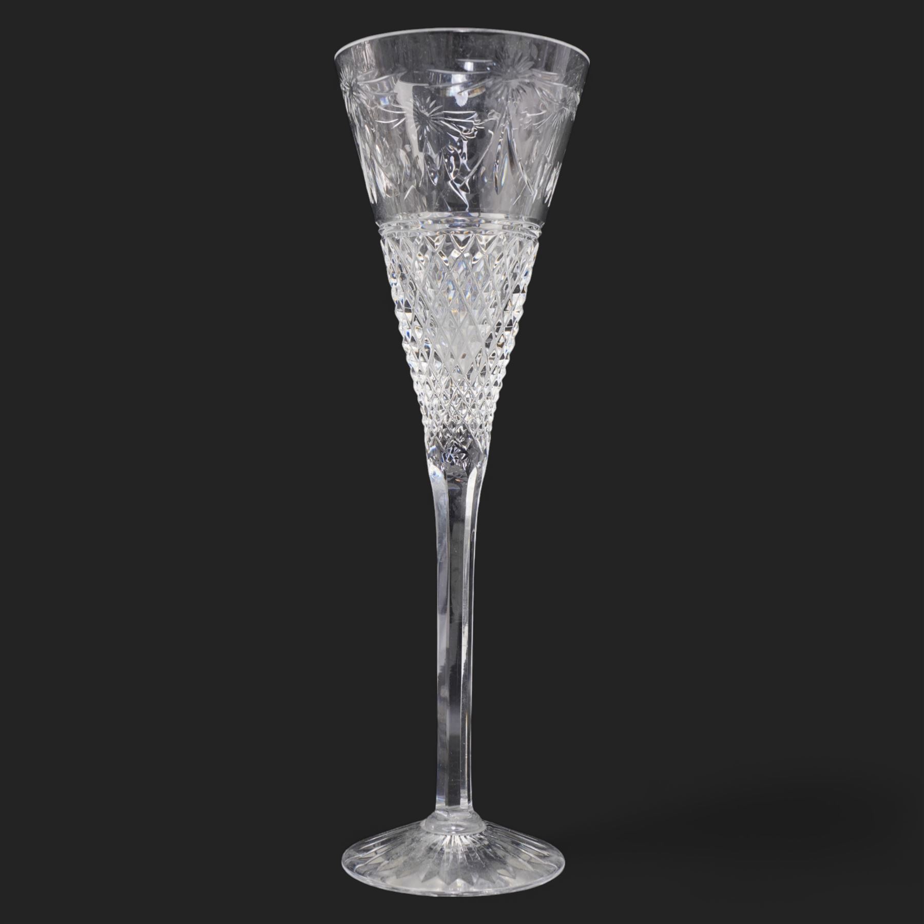 Stuart crystal 'Beaconsfield' pattern drinking glasses comprising twelve wine glasses and four champagne flutes (16)