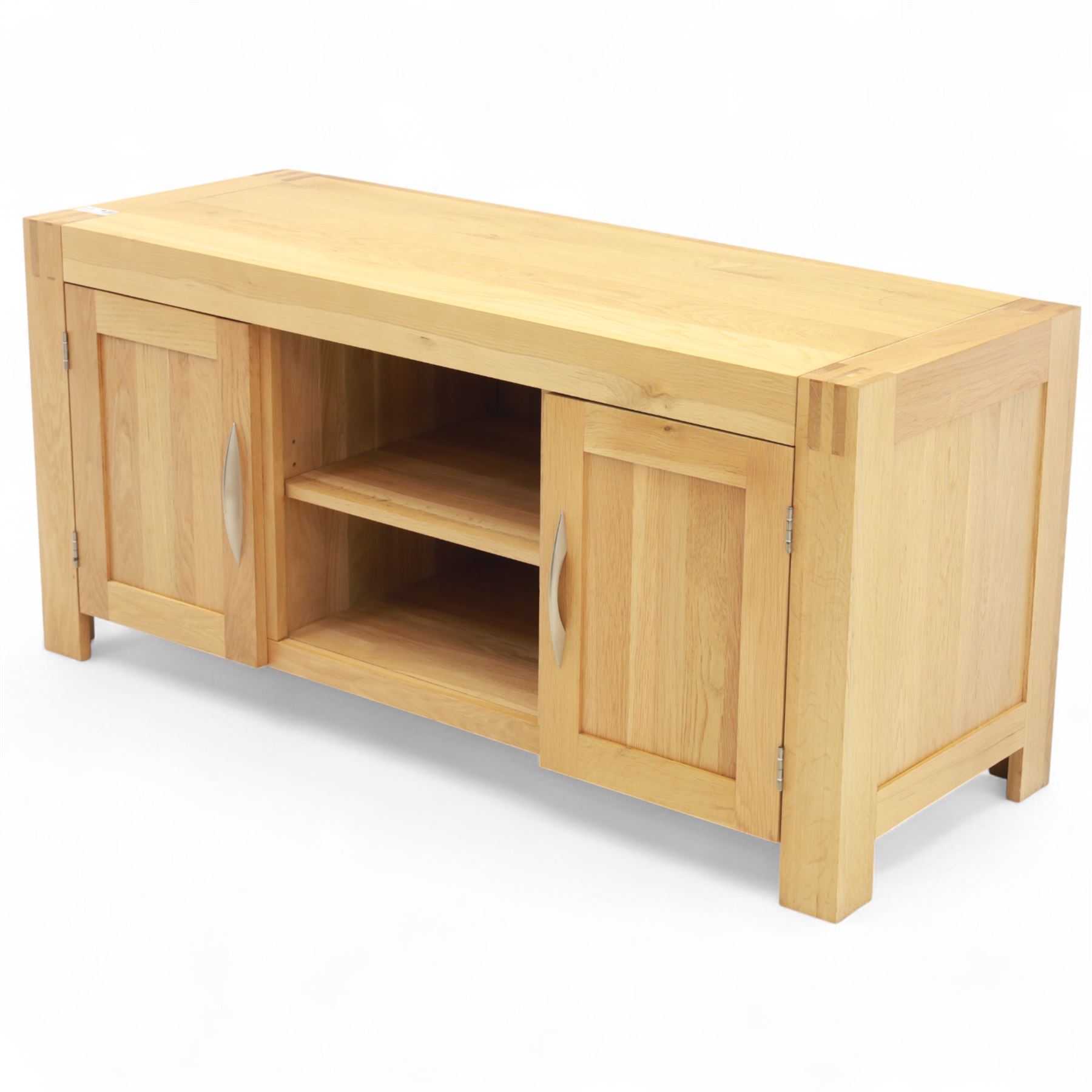 Contemporary solid oak television stand, rectangular top over an open central section with adjustable shelf, flanked by cupboard doors with vertical recessed panel fronts and brushed steel handles, on block feet