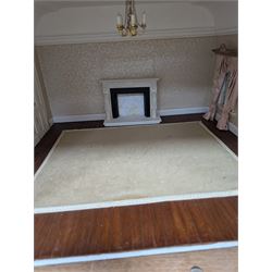 Two modern three storey dolls houses, each painted green with decorated interiors, both upon a single white wooden base, together with a large collection of dolls house furniture, accessories and figures 