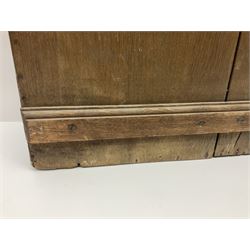 George III oak spoon rack and candle box, the rectangular backplate with shaped  pediment and two six aperture spoon racks, above a candlebox with hinged cover, with various brass spoons and a pair of brass candle snuffers, H56.5cm, W35cm, D14cm 